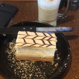 a piece of cake on a plate with a knife a piece of cake on a plate with a knife