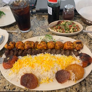 Sahara Restaurant - One skewer of Esfahan chicken, and one skewer of ground beef, with rice, charbroiled tomatoes, and potatoes tahdeeg - Persian/Iranian Near Me - Dallas, Texas Sahara Restaurant - One skewer of Esfahan chicken, and one skewer of ground beef, with rice, charbroiled tomatoes, and potatoes tahdeeg - Persian/Iranian Near Me - Dallas, Texas