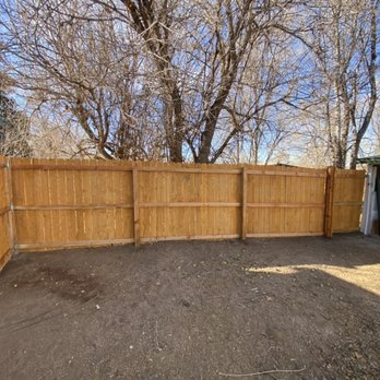 Tjs Property Maintenance - a backyard with a wooden fence - Fences & Gates Near Me - Denver, Colorado Tjs Property Maintenance - a backyard with a wooden fence - Fences & Gates Near Me - Denver, Colorado