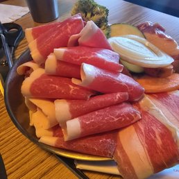 Thin sliced brisket and pork belly