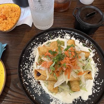 Letty's Authentic Mexican Cocina - Chicken flautas with a sour cream and green salsa! So good! - Mexican Near Me - Humble, Texas Letty's Authentic Mexican Cocina - Chicken flautas with a sour cream and green salsa! So good! - Mexican Near Me - Humble, Texas