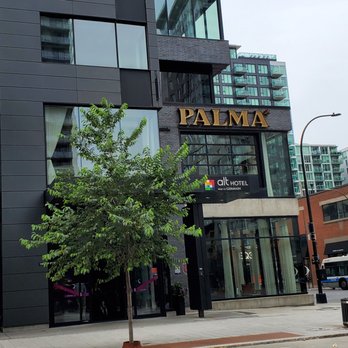 Palma - a view of a modern building on a street corner - Seafood Near Me - Montreal, Quebec Palma - a view of a modern building on a street corner - Seafood Near Me - Montreal, Quebec