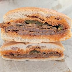 Calabria Bakery - Cross-section of my veal sandwich with mushrooms and green bell peppers