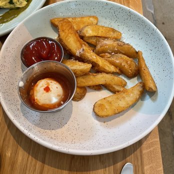 Bluestone Lane - Potato wedges served with ketchup and sweet pepper/ sour cream dip. - Coffee & Tea Near Me - Orange, California Bluestone Lane - Potato wedges served with ketchup and sweet pepper/ sour cream dip. - Coffee & Tea Near Me - Orange, California