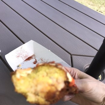 Hawaii’s Only - a person holding a half eaten sandwich - Food Stands Near Me - Kahuku, Hawaii Hawaii’s Only - a person holding a half eaten sandwich - Food Stands Near Me - Kahuku, Hawaii