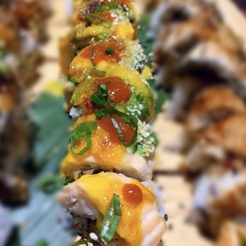 Oceano Sushi - Blossom Roll: cream cheese, shrimp tempura, mayo, topped with baeked salmon, avocado, drizzled with coconut mango glaze. Delicious! - Sushi Bars Near Me - Bothell, Washington Oceano Sushi - Blossom Roll: cream cheese, shrimp tempura, mayo, topped with baeked salmon, avocado, drizzled with coconut mango glaze. Delicious! - Sushi Bars Near Me - Bothell, Washington