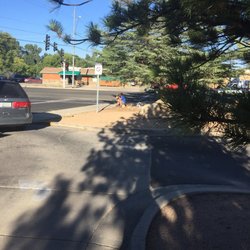 US Post Office - Corner panhandling. The shift just changed and a new panhandler just started as I took this photo. No joke.