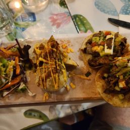 a hand holding a plate of food