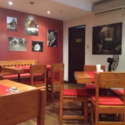 Balkan - Balkan's warm, wooden interior with red table runners.