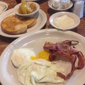 Cracker Barrel Old Country Store - Bacon, grits, toast eggs, fried apples... wife got pancakes with bacon and eggs and hash browns. - American Near Me - Gonzales, Louisiana Cracker Barrel Old Country Store - Bacon, grits, toast eggs, fried apples... wife got pancakes with bacon and eggs and hash browns. - American Near Me - Gonzales, Louisiana