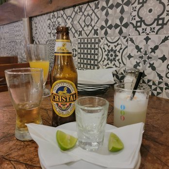 El Rocoto - Pisco shot , beer Cristal ,pisco cocktail drink and maracuja juice - Peruvian Near Me - Cerritos, California