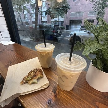 Michaeli Bakery - Window seating with 2 iced lattes and pistachio cherry croissant - Bakeries Near Me - New York, New York