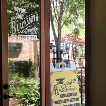 Blacksmith Wines and Provisions - a sign in front of a door - Wine Tasting Room Near Me - Livermore, California