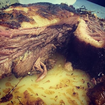 PDR - Brisket. Served over creamy stone ground grits, salsa verde, and locally grown zucchini. - New American Near Me PDR - Brisket. Served over creamy stone ground grits, salsa verde, and locally grown zucchini. - New American Near Me