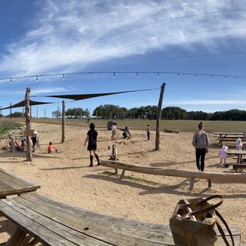 Jester King Brewery - Picnic area right outside the main barn eating area. Shaded sand pit and climbing area, lots of open green space. - Breweries Near Me - Austin, Texas Jester King Brewery - Picnic area right outside the main barn eating area. Shaded sand pit and climbing area, lots of open green space. - Breweries Near Me - Austin, Texas