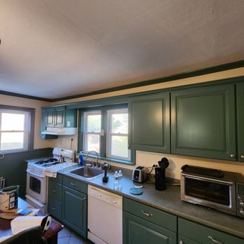 Rkb Painting - a kitchen with green cabinets and white appliances - Painters Near Me Rkb Painting - a kitchen with green cabinets and white appliances - Painters Near Me