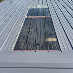 Ready Roofer - Hail damage to this metal roof on 8/1/2025 in Cheyenne, WY