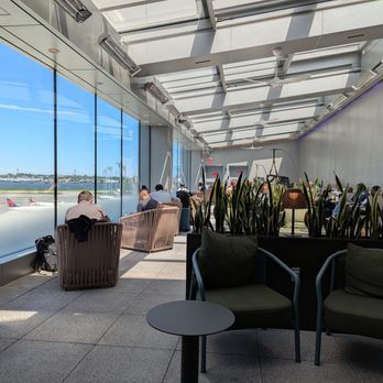 Delta Air Lines - Delta Sky Club at LaGuardia Airport (LGA) Terminal C. Outside on the patio. - Airlines Near Me Delta Air Lines - Delta Sky Club at LaGuardia Airport (LGA) Terminal C. Outside on the patio. - Airlines Near Me
