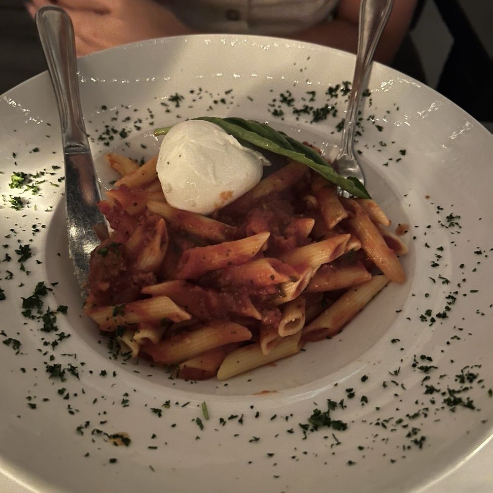 Pasta with meat sauce and burrata