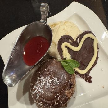 Anthony's Restaurant - Chocolate molten cake with vanilla ice cream, a raspberry sauce and a heart made with melted chocolate - Seafood Near Me - Gig Harbor, Washington Anthony's Restaurant - Chocolate molten cake with vanilla ice cream, a raspberry sauce and a heart made with melted chocolate - Seafood Near Me - Gig Harbor, Washington