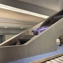 John F. Kennedy International Airport - Love that luggage comes down like this - can you guess what my luggage is?
