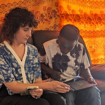 Tennessee Language Center - Teacher and student going over tablet function for class - Language Schools Near Me - Nashville, Tennessee Tennessee Language Center - Teacher and student going over tablet function for class - Language Schools Near Me - Nashville, Tennessee