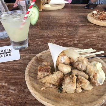 Naked for Satan - Popcorn chicken and Hayley's Halo drink - Bars Near Me - Fitzroy, VIC Naked for Satan - Popcorn chicken and Hayley's Halo drink - Bars Near Me - Fitzroy, VIC