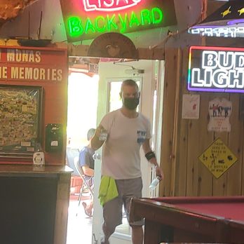 Monas - a man walking into a bar - Gay Bars Near Me - Fort Lauderdale, Florida