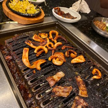 Buga Korean BBQ - Squid garlic pork belly and corn cheese. Last plate - Barbeque Near Me - San Diego, California