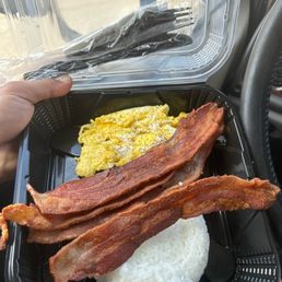 Bacon and eggs. I added my own rice. Bacon and eggs. I added my own rice.