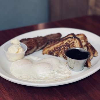 Hugo's Family Restaurant - Jumbo French toast with eggs and sausage - Breakfast & Brunch Near Me - Jenks, Oklahoma Hugo's Family Restaurant - Jumbo French toast with eggs and sausage - Breakfast & Brunch Near Me - Jenks, Oklahoma