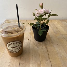 a cup of coffee and a flower a cup of coffee and a flower