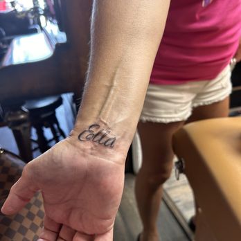 Storytellers Tattoo - Beautiful script of granddaughters name - Tattoo Near Me - Las Vegas, Nevada
