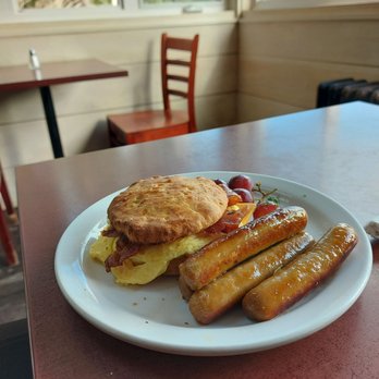 The Dancing Goat - Breakfast sandwich (toasted cheese biscuit with bacon, cheese and egg) with additional sausage side order - Bakeries Near Me - North East Margaree, Nova Scotia