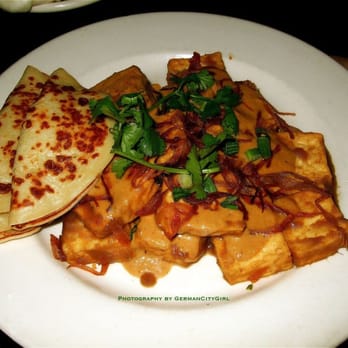 The Triple Door - Hawker Tofu - vegetarian dish featuring tamarind tofu wok-fried in a Malaysian peanut sauce + served with roti flatbread. - Asian Fusion Near Me - Seattle, Washington The Triple Door - Hawker Tofu - vegetarian dish featuring tamarind tofu wok-fried in a Malaysian peanut sauce + served with roti flatbread. - Asian Fusion Near Me - Seattle, Washington
