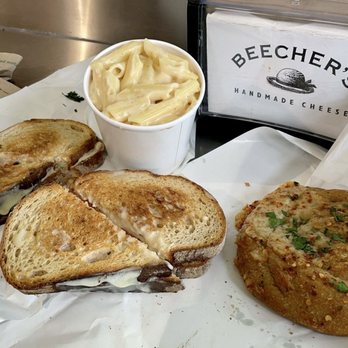 Beecher's Handmade Cheese - Chicken and Mama Lil's Peppers Sandwich (top left), "World's Best" Mac & Cheese (top right), Flagship (bottom left), Breadzel (bottom right) - Cheese Shops Near Me - Seattle, Washington Beecher's Handmade Cheese - Chicken and Mama Lil's Peppers Sandwich (top left), "World's Best" Mac & Cheese (top right), Flagship (bottom left), Breadzel (bottom right) - Cheese Shops Near Me - Seattle, Washington