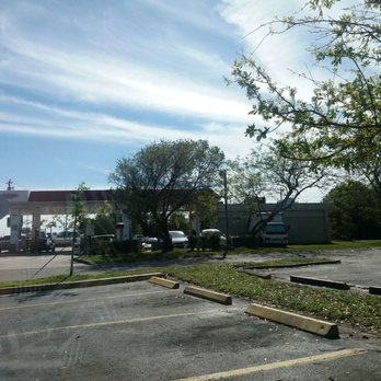 Exxon - a stop sign in a parking lot - Gas Stations Near Me - Davie, Florida