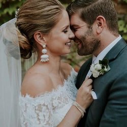 Bridal Hair & Makeup by Edie - Bride and Groom Embrace after ceremony as Husband and Wife