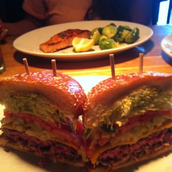 R+D Kitchen - Cheeseburger in foreground ($13) and salmon and brussel sprouts in background ($20) - New American Near Me - Santa Monica, California R+D Kitchen - Cheeseburger in foreground ($13) and salmon and brussel sprouts in background ($20) - New American Near Me - Santa Monica, California