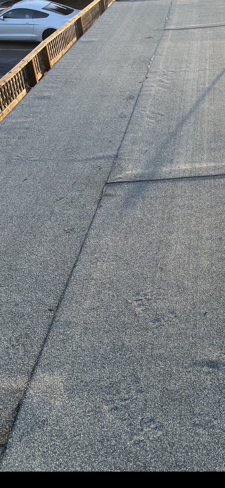 Slide of Hernandez's Roofing