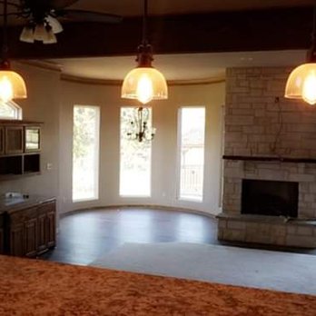 Top Hand Construction, LLC - a kitchen and living room - General Contractors Near Me