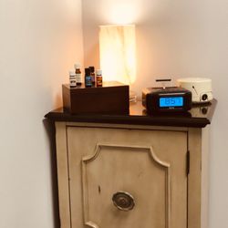 Massage By Gina - Corner for essential oils, CBD balm, coconut oil and items needed for sugar foot scrubs.