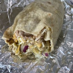 My Carnitas burrito with green sauce and frijoles. My Carnitas burrito with green sauce and frijoles.