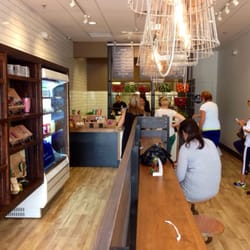 Nekter Juice Bar - Cool airy layout.  Long bar to sit at with antique Edison bulbs and hard wood.