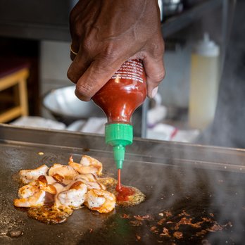 Tomo - a person cooking food on a grill - Sushi Bars Near Me - New Albany, Indiana Tomo - a person cooking food on a grill - Sushi Bars Near Me - New Albany, Indiana