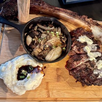 Wolf's Steakhouse - 40 oz Tomahawk steak with mushrooms, onions amd mash potatoes! - Steakhouses Near Me - Cooper City, Florida Wolf's Steakhouse - 40 oz Tomahawk steak with mushrooms, onions amd mash potatoes! - Steakhouses Near Me - Cooper City, Florida