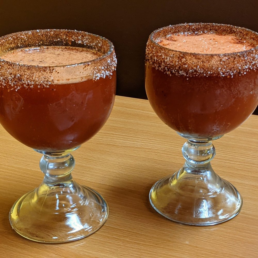 Plaza Garibaldi - two glasses of beverage on a table - Mexican Near Me - Coachella, California Plaza Garibaldi - two glasses of beverage on a table - Mexican Near Me - Coachella, California