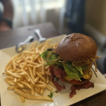 The Gold Vine Bistro - The Lisa burger 1/2 lb burger, lettuce, tomato,3 cheeses, bacon, jalapeños, onion straws, avocado, pastrami & thousand island - New American Near Me - Somerset, California The Gold Vine Bistro - The Lisa burger 1/2 lb burger, lettuce, tomato,3 cheeses, bacon, jalapeños, onion straws, avocado, pastrami & thousand island - New American Near Me - Somerset, California