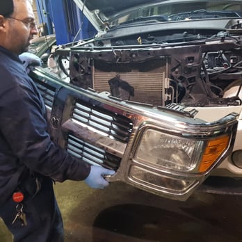 The Brake Shop - Removing the front grill to access the Receiver Drier,We are the automotive experts in Taylor MI. - Auto Repair Near Me - Taylor, Michigan The Brake Shop - Removing the front grill to access the Receiver Drier,We are the automotive experts in Taylor MI. - Auto Repair Near Me - Taylor, Michigan