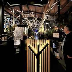 Understory Bar - Host podium. Reservations are highly recommended.